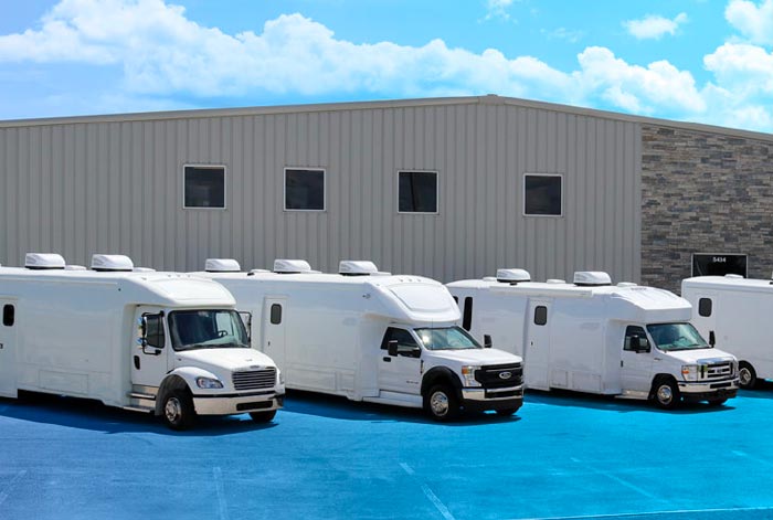 A lineup of mobile clinics outdoors