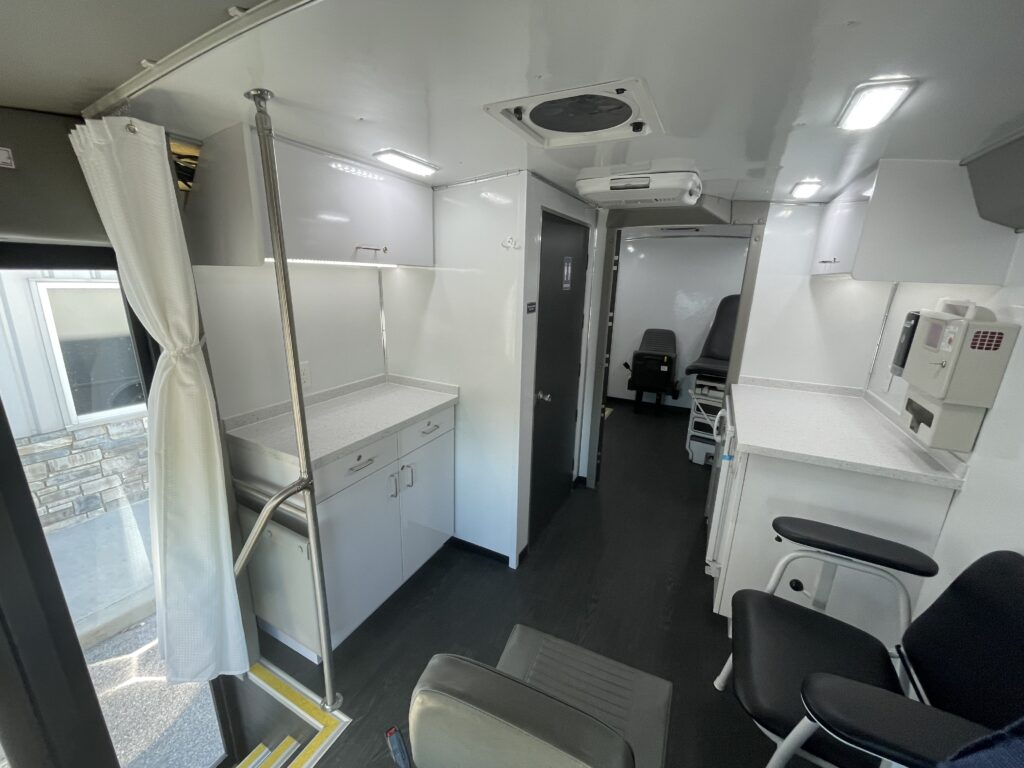 The inside of a Exam Room and Blood Draw Station Mobile Health Vehicle, Group C