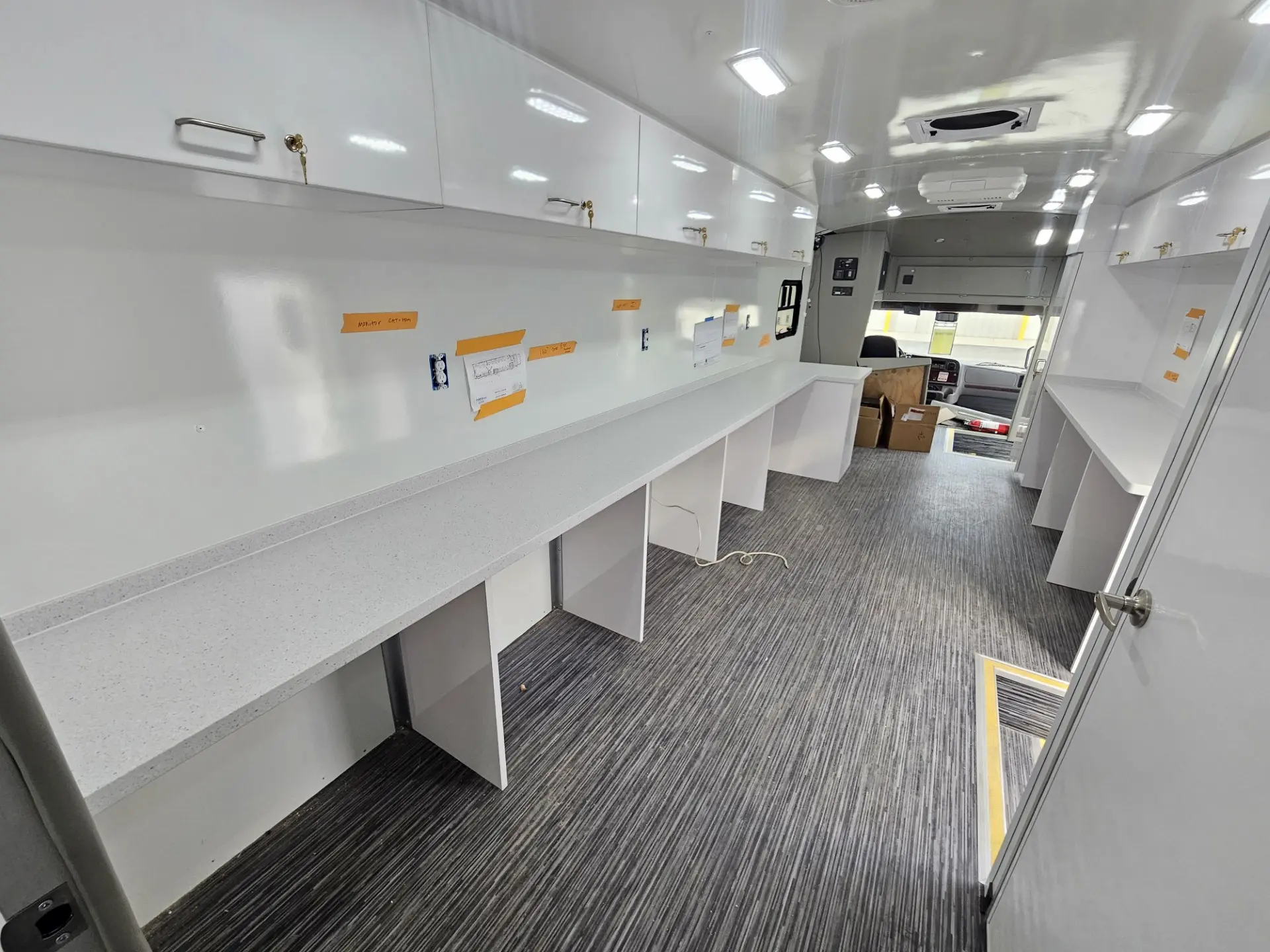 Interior of the City of Norfolk Mobile Workforce Center showing workstation counters along the side wall